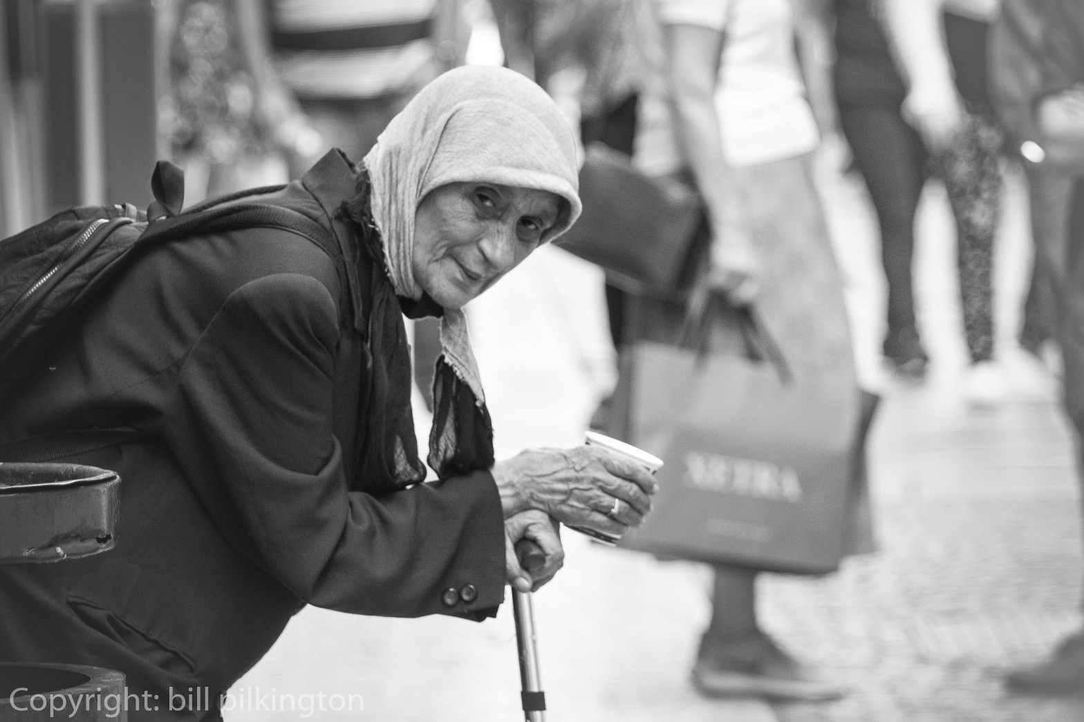 old lady begging on the streets of Verona